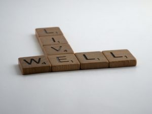 live well spelled in scrabble pieces